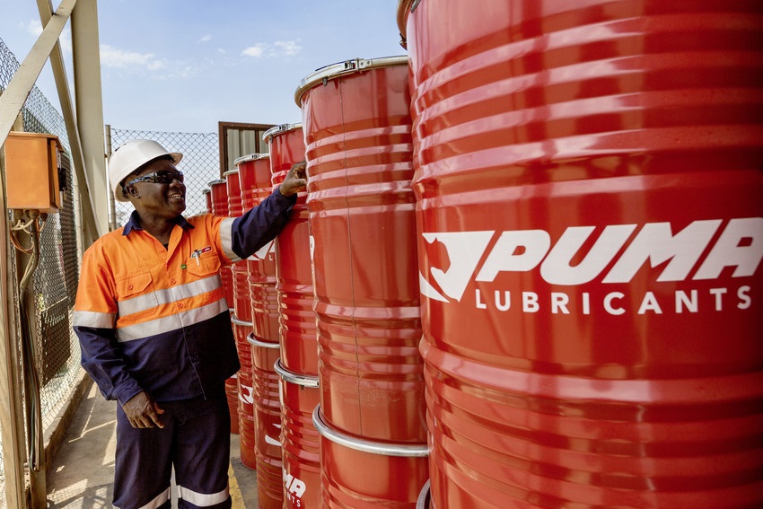 Operations specialist inspecting lubricant inventory